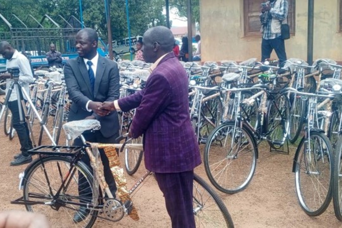 Oweek. Deo Kagimu handing over a bicycle to one of Kabaka's chiefs Oweek. Deo Kagimu handing over a bicycle to one of Kabaka's chiefs